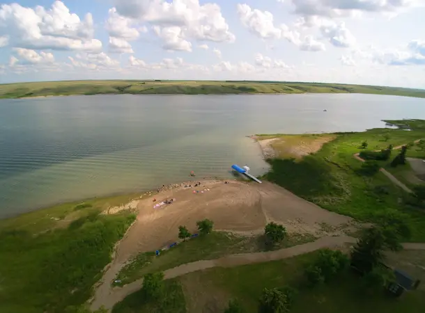 Sandy beach and shoreline trails along Lake Diefenbaker
